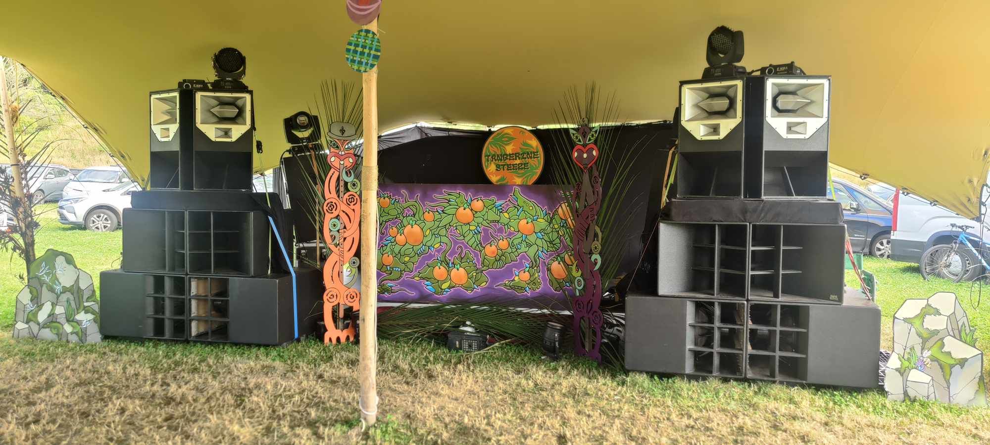 The rig at an outdoor stage, with colourful backdrop and decorations